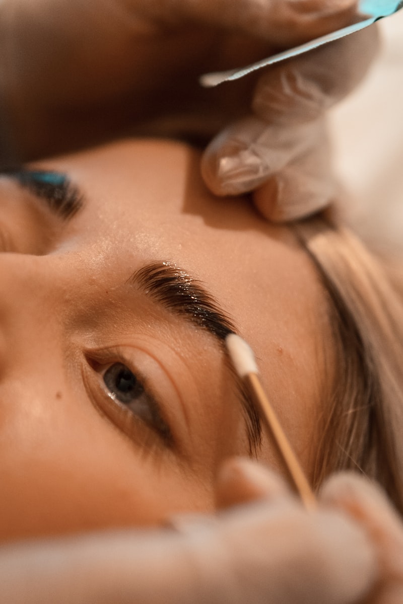 Brow grooming close-up at a beauty salon